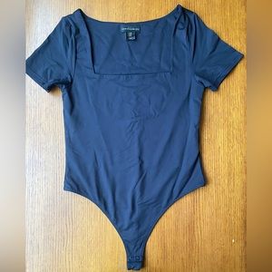 Women’s black body suit